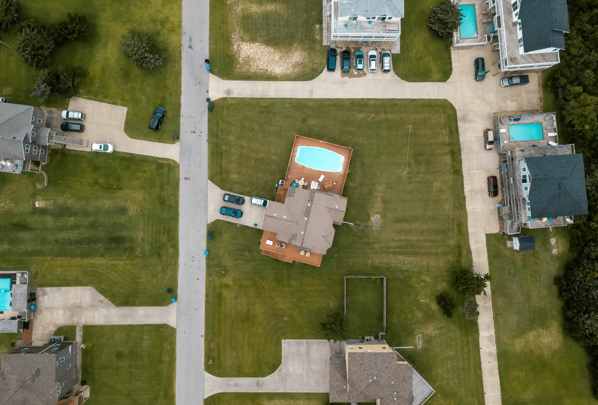 Top-down aerial photo of a rural property with a pool