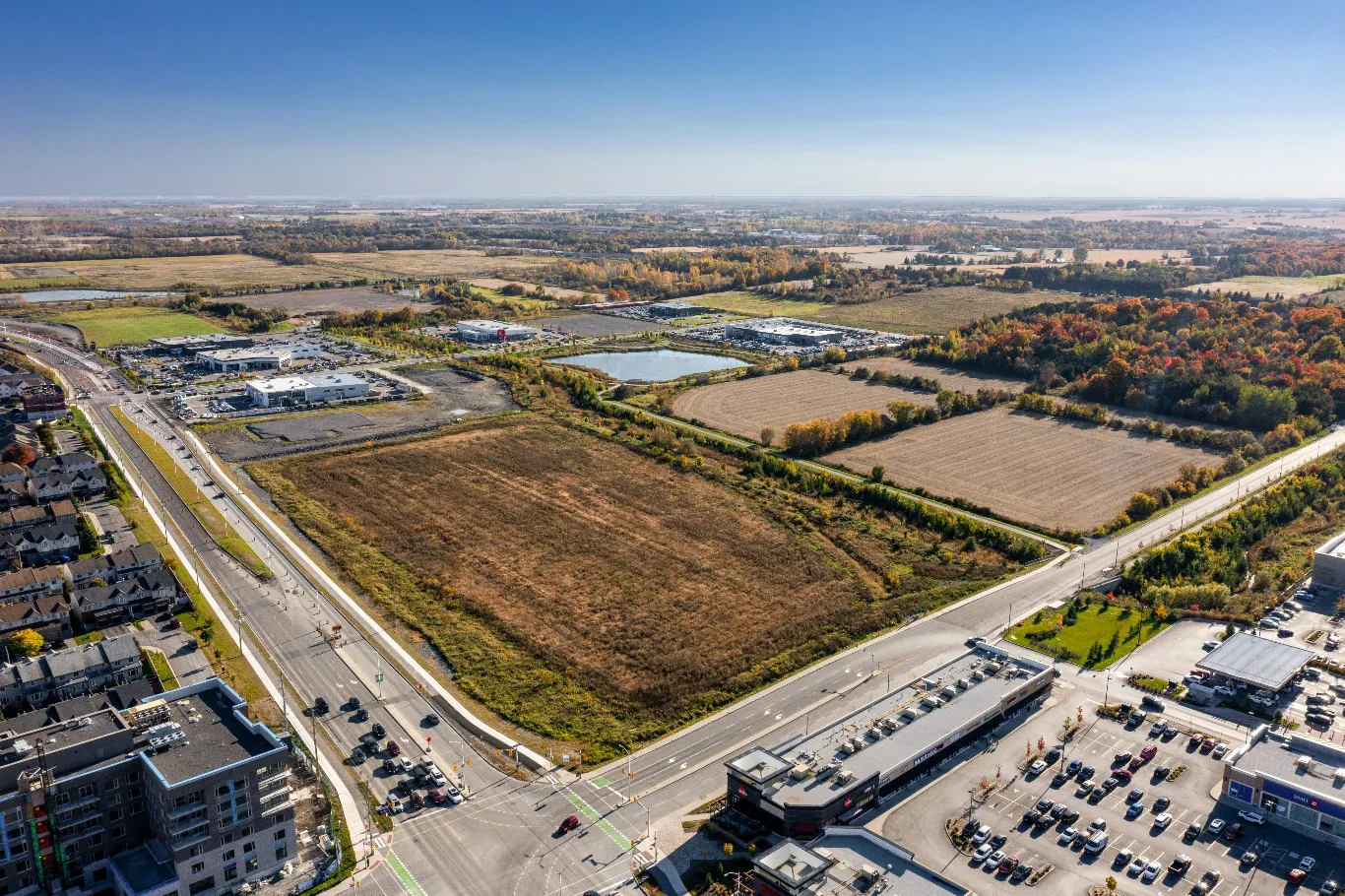 Aerial view of a commercial property and its surroundings